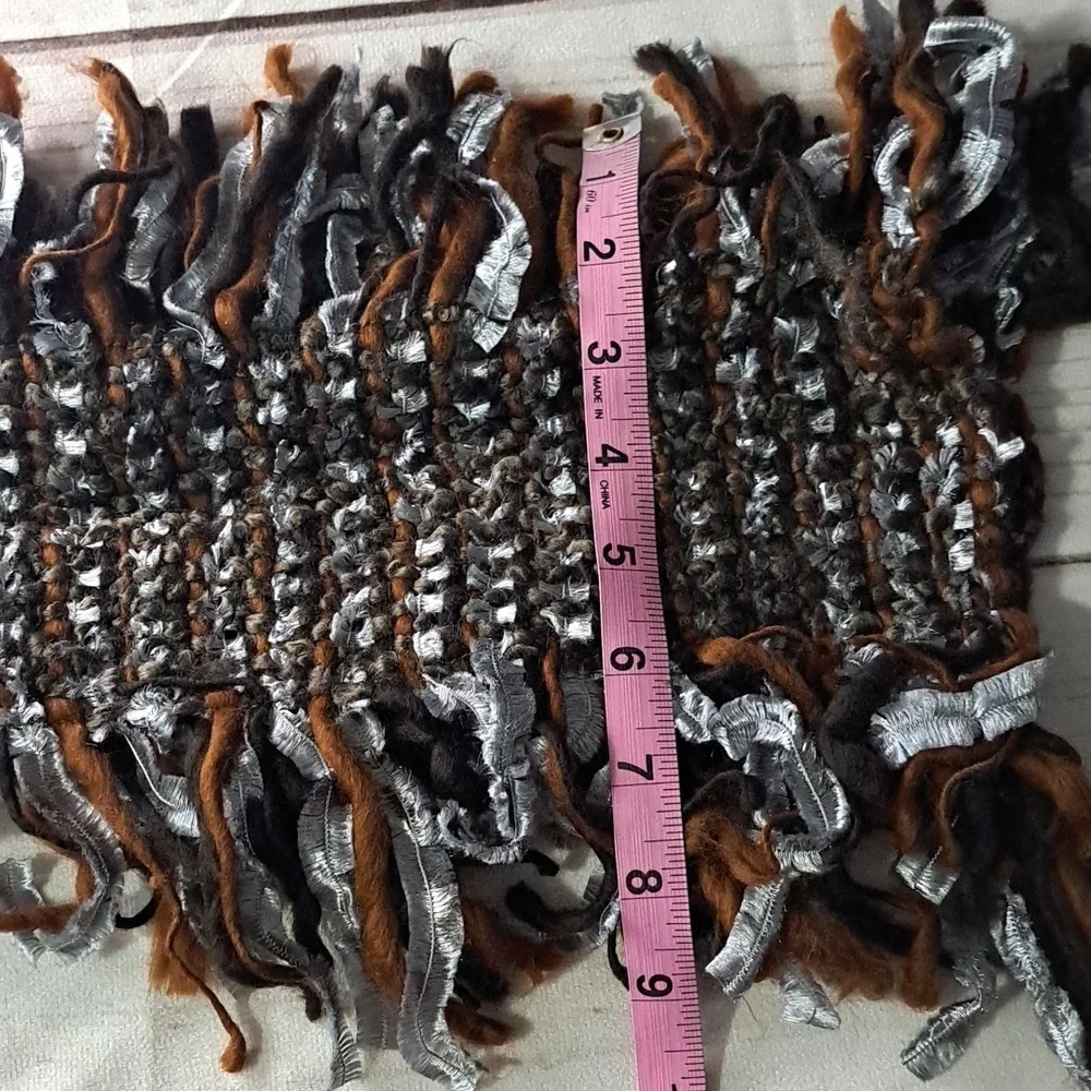 Eyeful Fringe Knit Scarf in Brown And Silver Has Faux Feather Detail